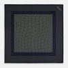 View 4 of product The Turnbull & Asser Navy and Gold Silk Pocket Square is handmade, featuring small gold polka dots on navy with a solid border, displayed neatly folded with one corner turned up.
