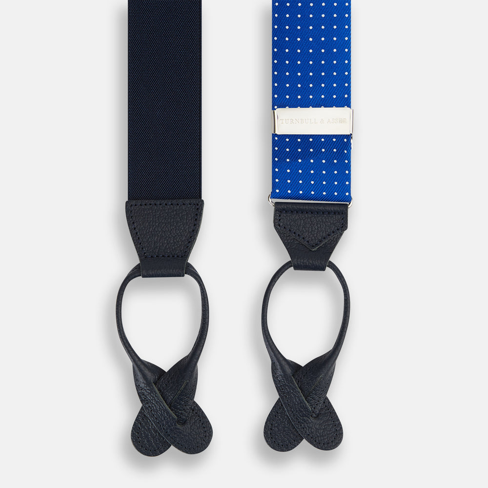 Turnbull & Asser Pale Blue & White Small Spot Adjustable Silk and Navy Leather Braces, arranged in an M shape on a white background—a stylish, refined accessory for any formal wardrobe.