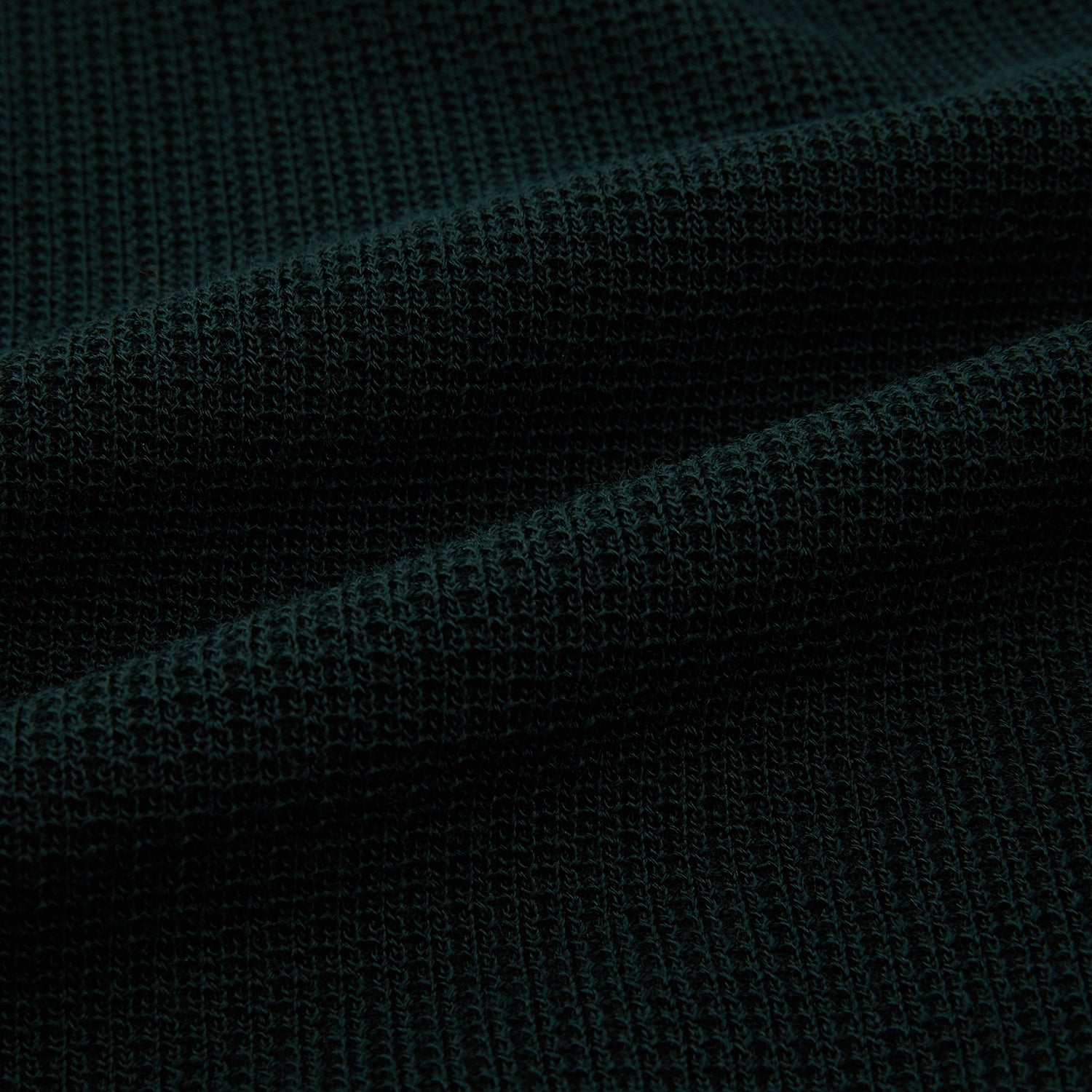 View 6 of product The Forest Green Greenwich Knitted Overshirt by Turnbull & Asser, crafted from Italian wool, features long sleeves, a collar, front buttons, and two chest pockets—one flap, one open—shown on a white background.