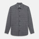 The Turnbull & Asser Charcoal Melange Check Hampstead overshirt, a long-sleeve button-up with a collar and two zippered side pockets, is laid flat on a light gray background.