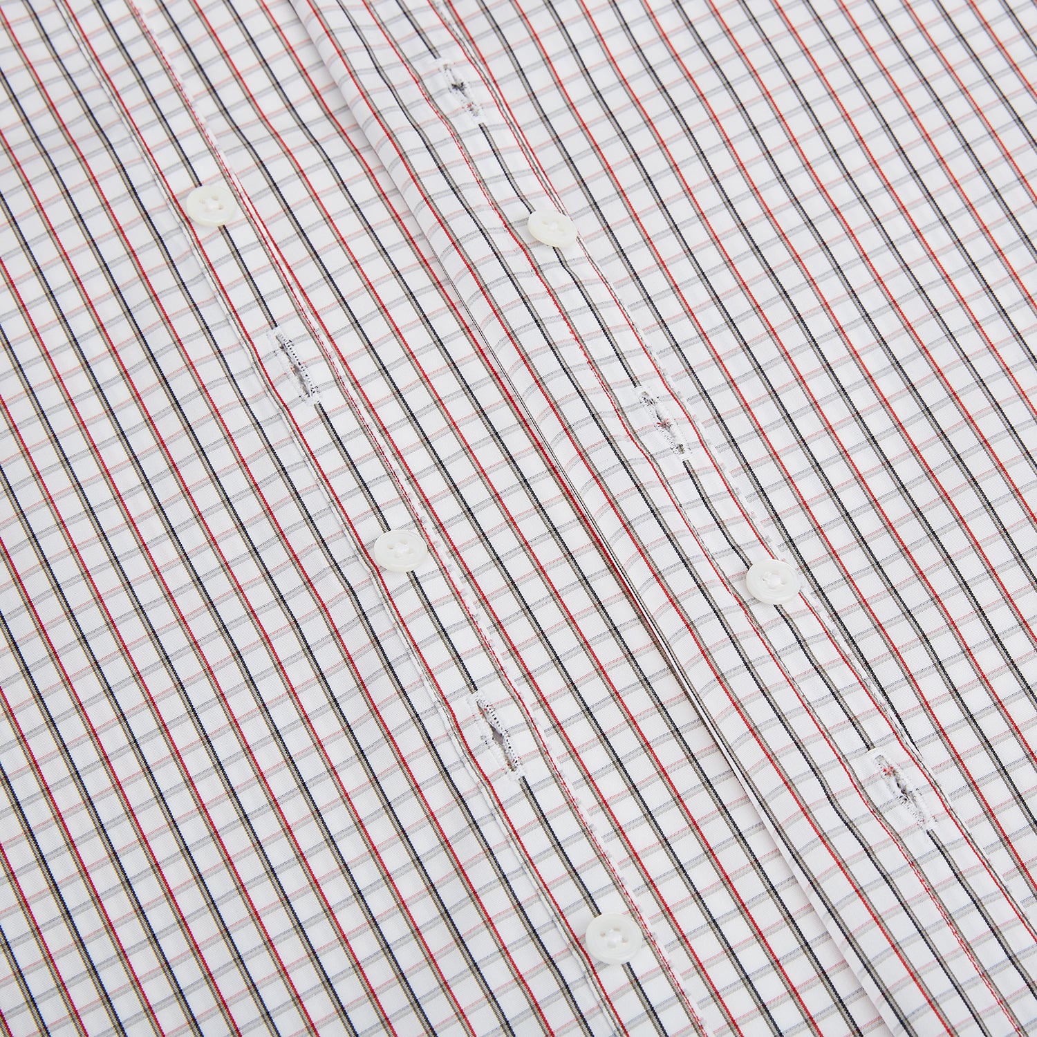 View 7 of product The Turnbull & Asser Red and Midnight Blue Tattersall Check Windsor Shirt features British craftsmanship, shown laid flat with sleeves extended and collar neatly folded.