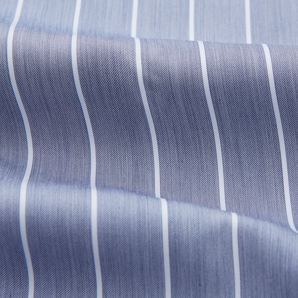 The Turnbull & Asser Pale Blue and White Pinstripe Cotton Blend Weekend Fit Finch Shirt features long sleeves, a chest pocket, and white buttons—ideal for classic, casual style. Shown laid flat on a white background.