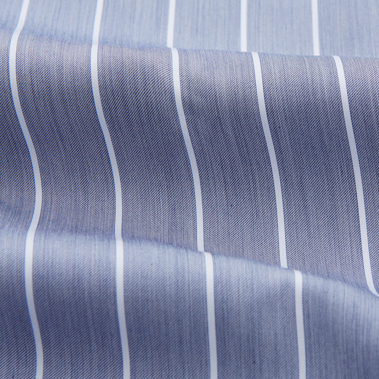 View 4 of product The Turnbull & Asser Pale Blue and White Pinstripe Cotton Blend Weekend Fit Finch Shirt features long sleeves, a chest pocket, and white buttons—ideal for classic, casual style. Shown laid flat on a white background.