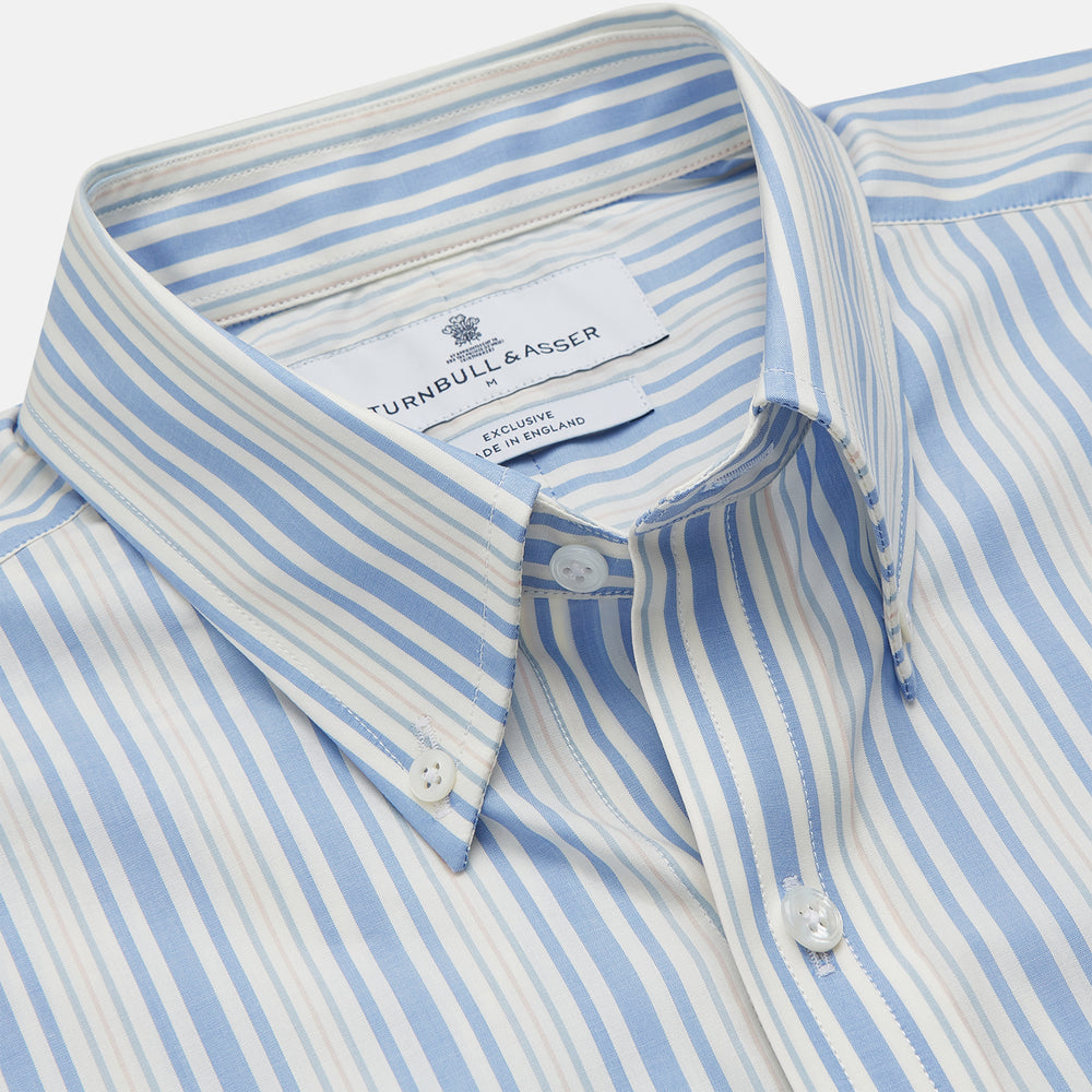 The Turnbull & Asser Blue Multi Stripe Wool Blend Weekend Fit Hayne Shirt features vertical blue, yellow, and white stripes, a button-down collar, and buttoned cuffs. Laid flat on a white background.