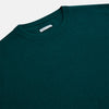 View 2 of product The Turnbull & Asser Moss Green Cashmere Round Neck Jumper, shown on a plain white background, is men's knitwear with long sleeves and a classic design featuring ribbed cuffs, neckline, and hem for timeless style.