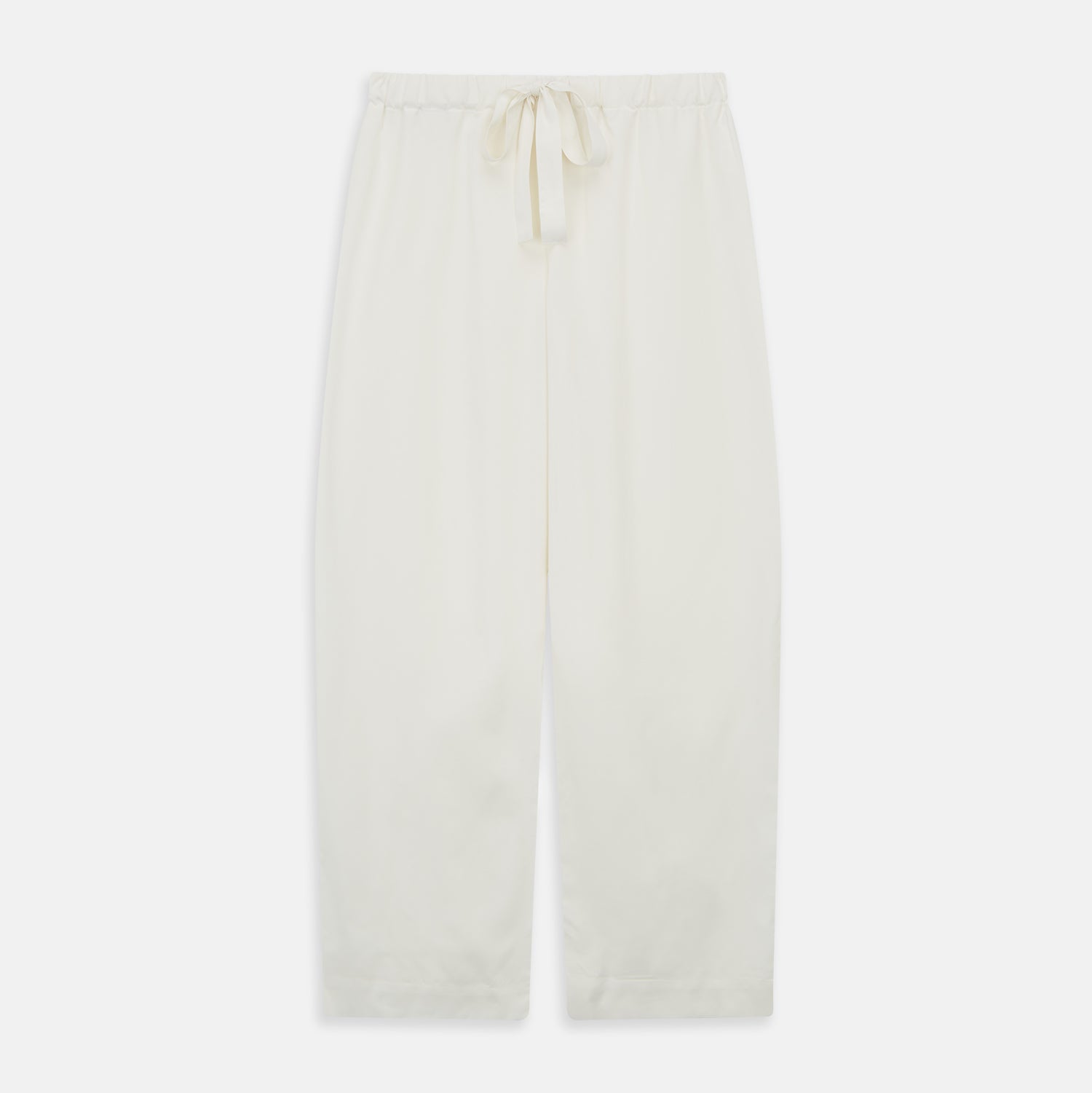 View 6 of product The Women's Harriet Cream Silk Pyjama Set by Turnbull & Asser features a white sand-washed silk button-up top with black piping and chest pocket, plus matching drawstring pants, all shown against a white background.