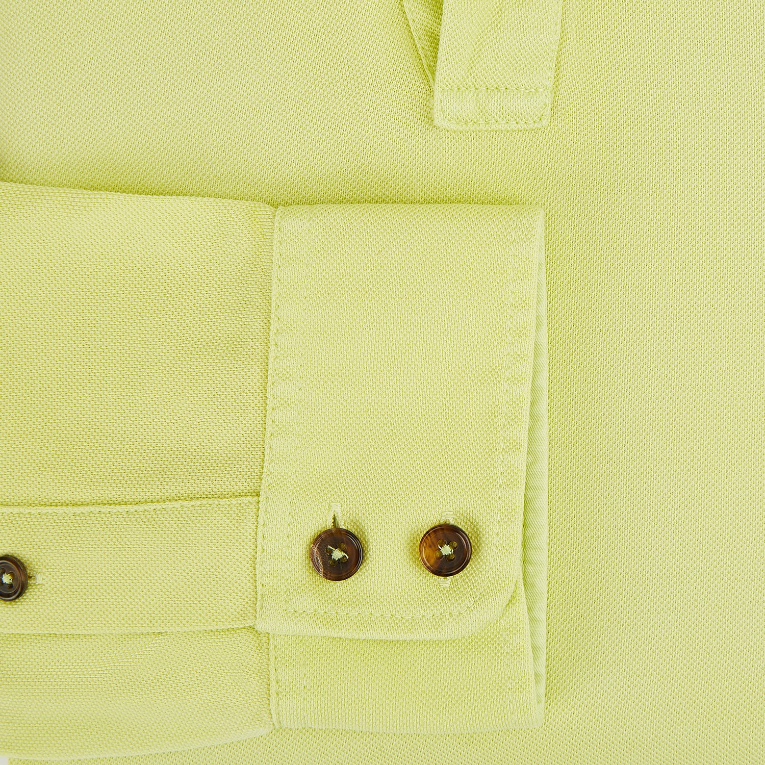 View 4 of product The Turnbull & Asser Lime Green Rugby Polo Shirt is a pure cotton, long-sleeve shirt with a collar and no visible buttons, displayed flat against a white background.