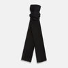 View 1 of product The Turnbull & Asser Charcoal Melange Cashmere Scarf features a smooth texture, subtle frayed edges, and a loosely knotted style, elegantly displayed on a white background—an ideal luxury accessory for any season.