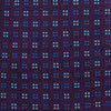 View 3 of product The Turnbull & Asser MINI SQUARE SPOT PLUM BLUE TIE is a luxury English silk necktie in plum, featuring a blue and white grid pattern of small squares, displayed rolled up against a simple light background.