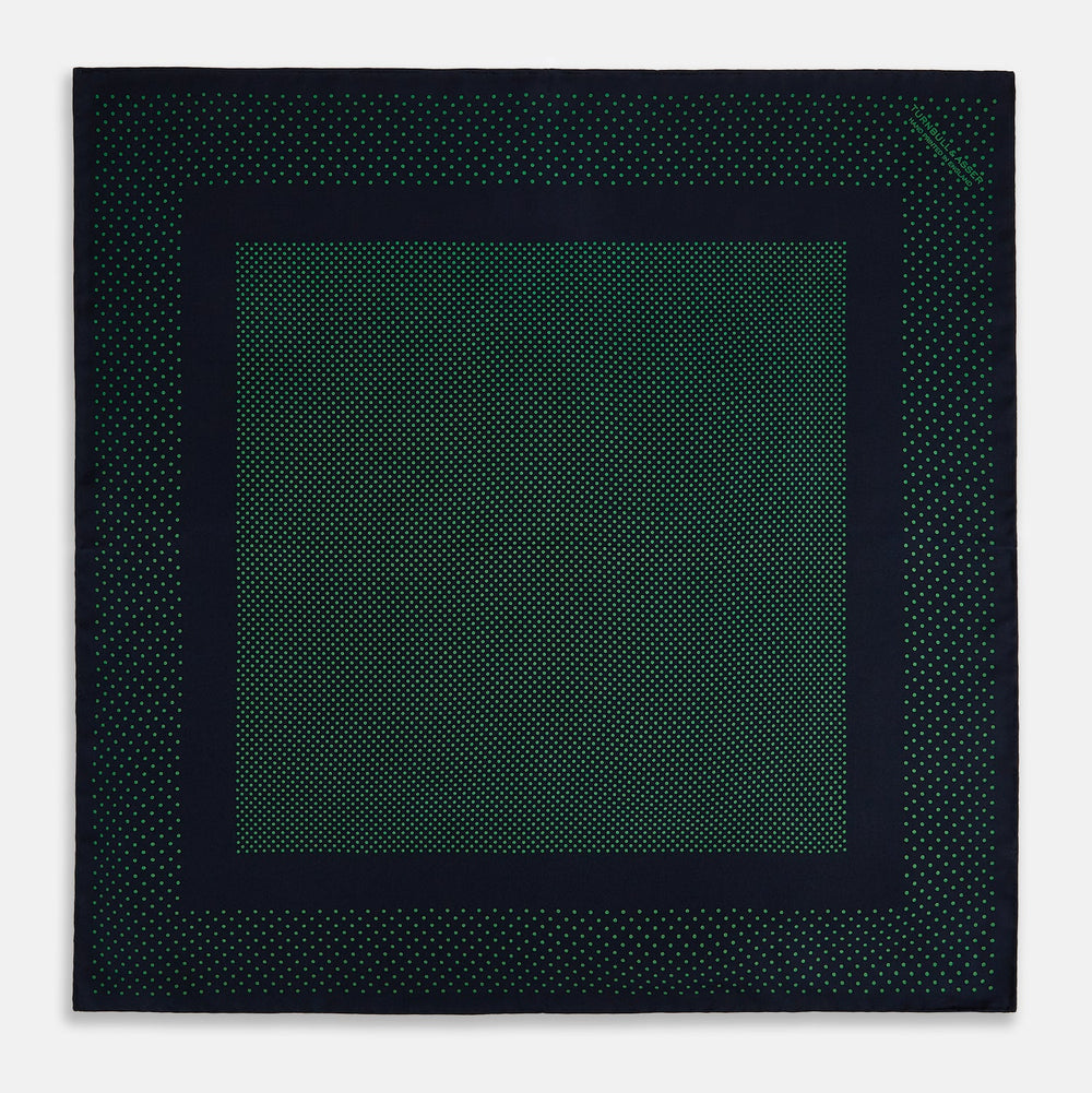 The Turnbull & Asser Navy and Green Dot Silk Pocket Square features dense green polka dots on navy silk, a solid navy border, and a band of spaced green dots—expertly handmade with precise finishing for an elegant look.