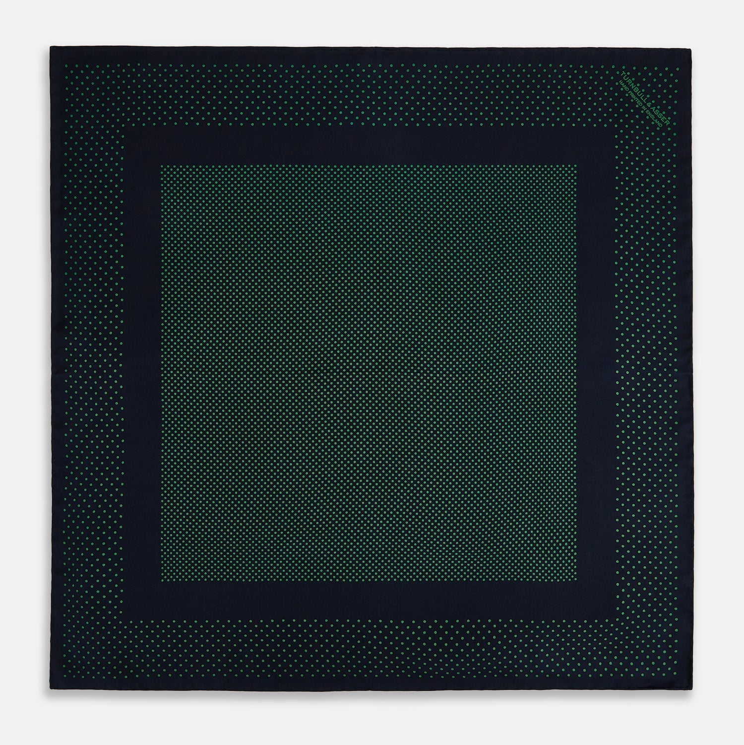 View 4 of product The Turnbull & Asser Navy and Green Dot Silk Pocket Square features dense green polka dots on navy silk, a solid navy border, and a band of spaced green dots—expertly handmade with precise finishing for an elegant look.