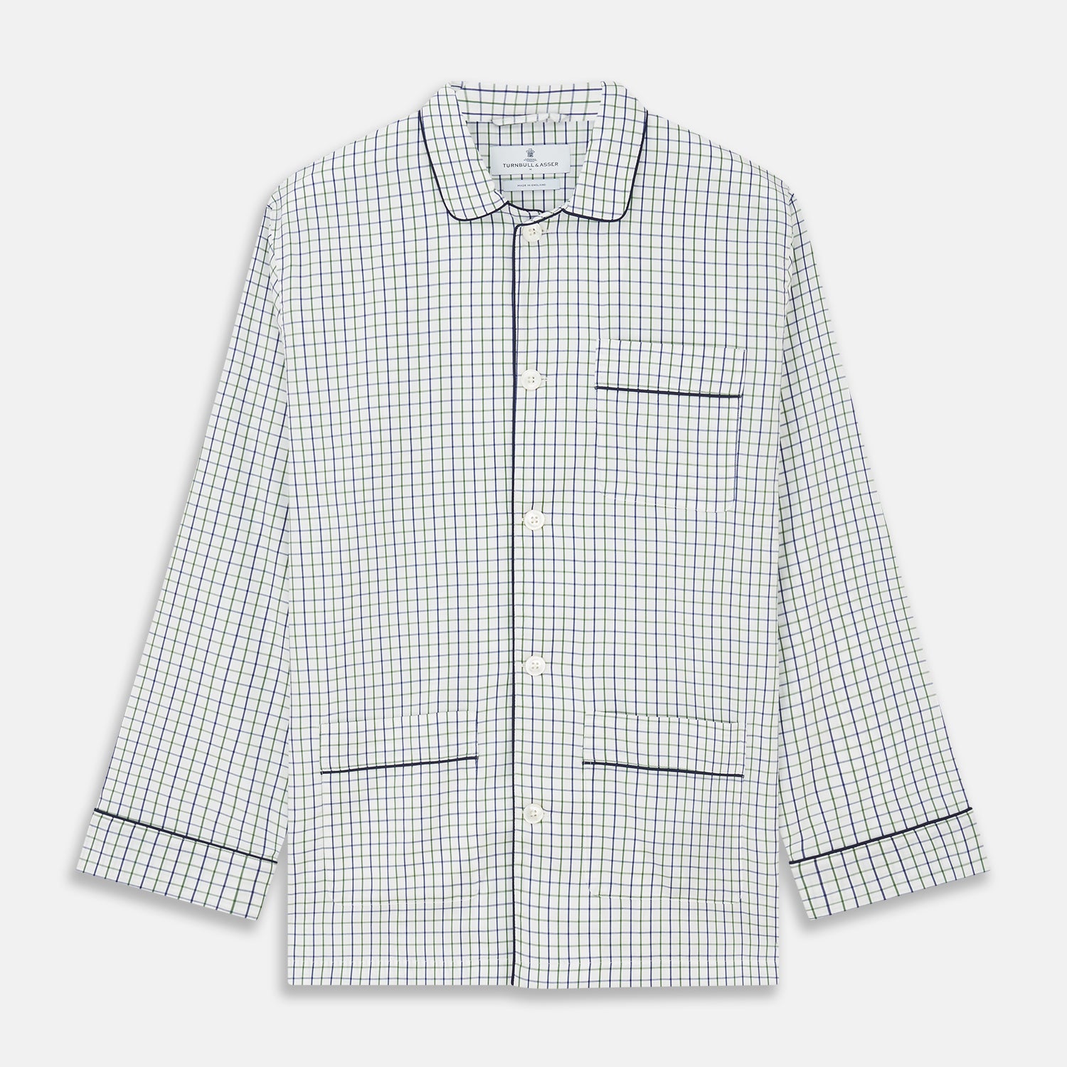 View 5 of product The Turnbull & Asser Green and Blue Check Cotton Hyde Pyjama Set for men features a long-sleeve, button-up top and pants with contrasting dark piping, shown laid flat on a white background.