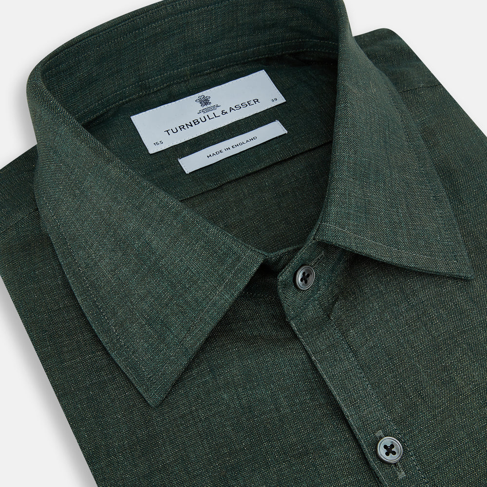 The Forest Green Linen Westminster Shirt by Turnbull & Asser features long sleeves, a Turnbull collar, and a button-up design, shown laid flat on a white background.