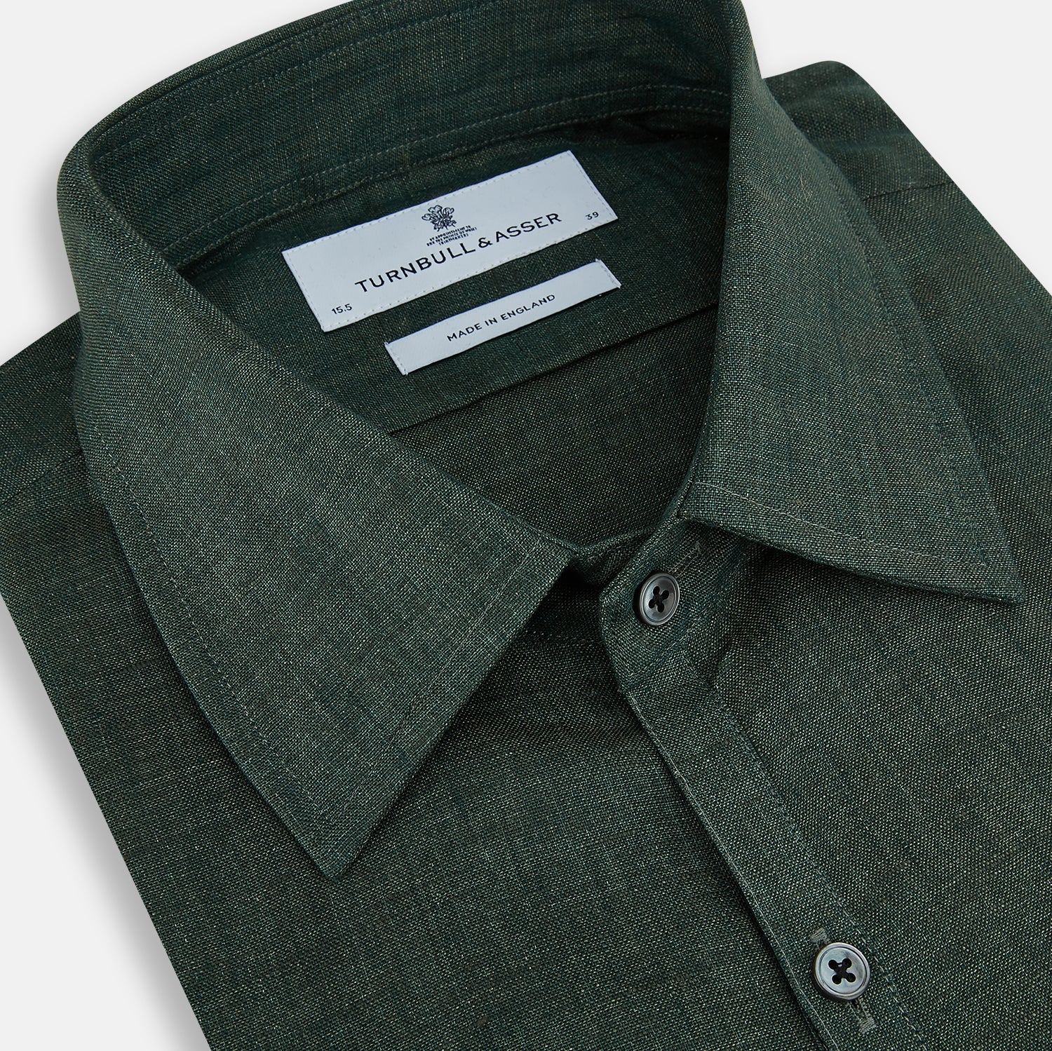 View 2 of product The Forest Green Linen Westminster Shirt by Turnbull & Asser features long sleeves, a Turnbull collar, and a button-up design, shown laid flat on a white background.