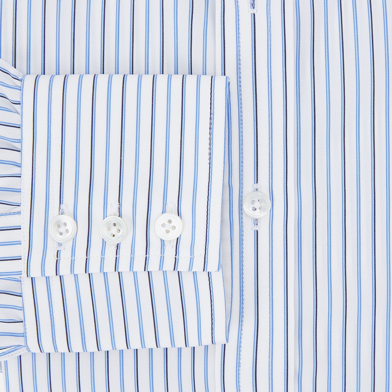 View 4 of product The Blue and Navy Double Stripe Mayfair Shirt by Turnbull & Asser features a classic T&A collar and thin blue stripes on a white background, displayed against a plain white surface.