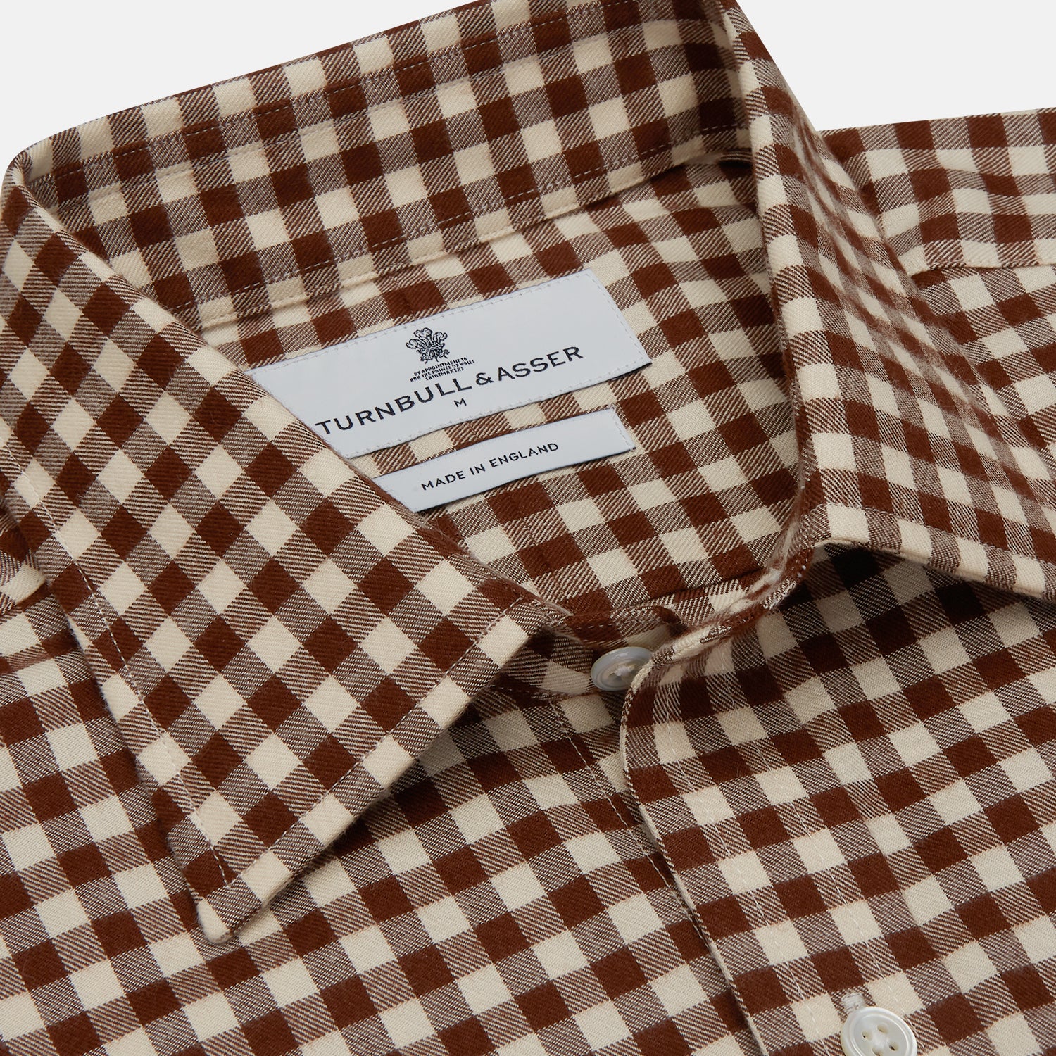 View 4 of product The Turnbull & Asser Brown Check Weekend Fit Shirt features a Derby collar, 1-button cuffs, and a brown check pattern—ideal for winter layering. Shown against a plain white background.