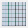 View 1 of product The Turnbull & Asser Hand Rolled Blue and Green Tattersall Check Handkerchief—a white cotton pocket square with blue, green, and black check pattern—is neatly displayed on a plain white background.