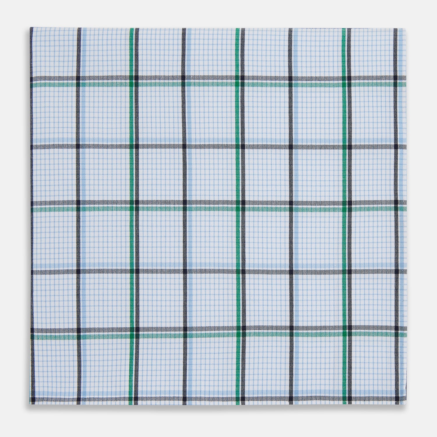 View 1 of product The Turnbull & Asser Hand Rolled Blue and Green Tattersall Check Handkerchief—a white cotton pocket square with blue, green, and black check pattern—is neatly displayed on a plain white background.