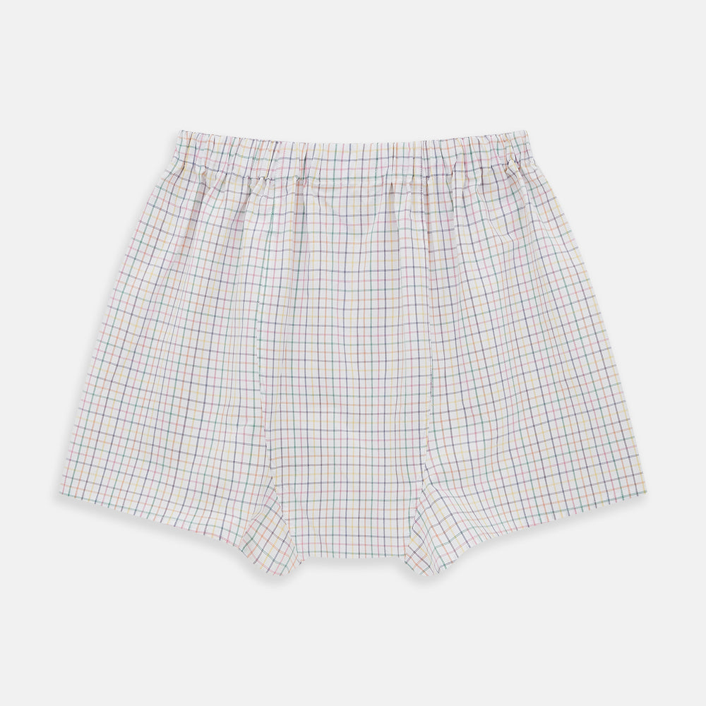 The Rainbow Check Godfrey Boxer Shorts by Turnbull & Asser are crafted from white Italian cotton with an elastic waistband and feature a colorful checked pattern in thin blue, red, and green lines. They are shown flat against a white background.