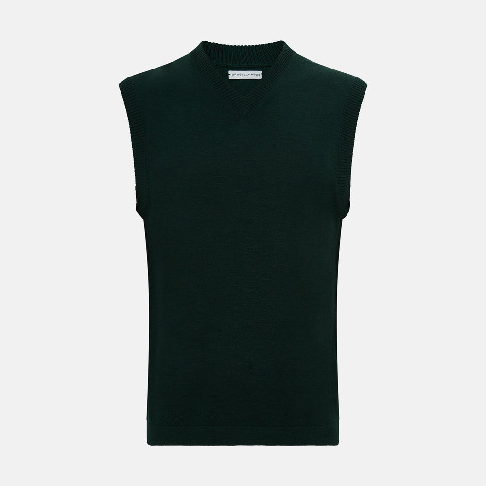 The Turnbull & Asser Forest Green Fine Merino V-Neck Vest is a sleeveless knitwear piece with ribbed edges, shown on a plain white background—ideal for elevating men’s sophisticated wardrobes.