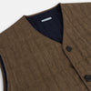 View 2 of product The Turnbull & Asser Pine Cone Quilted Linen Herringbone Waistcoat features a brown, sleeveless design with dark buttons, two angled side pockets, and a chest pocket, shown on a plain white background.