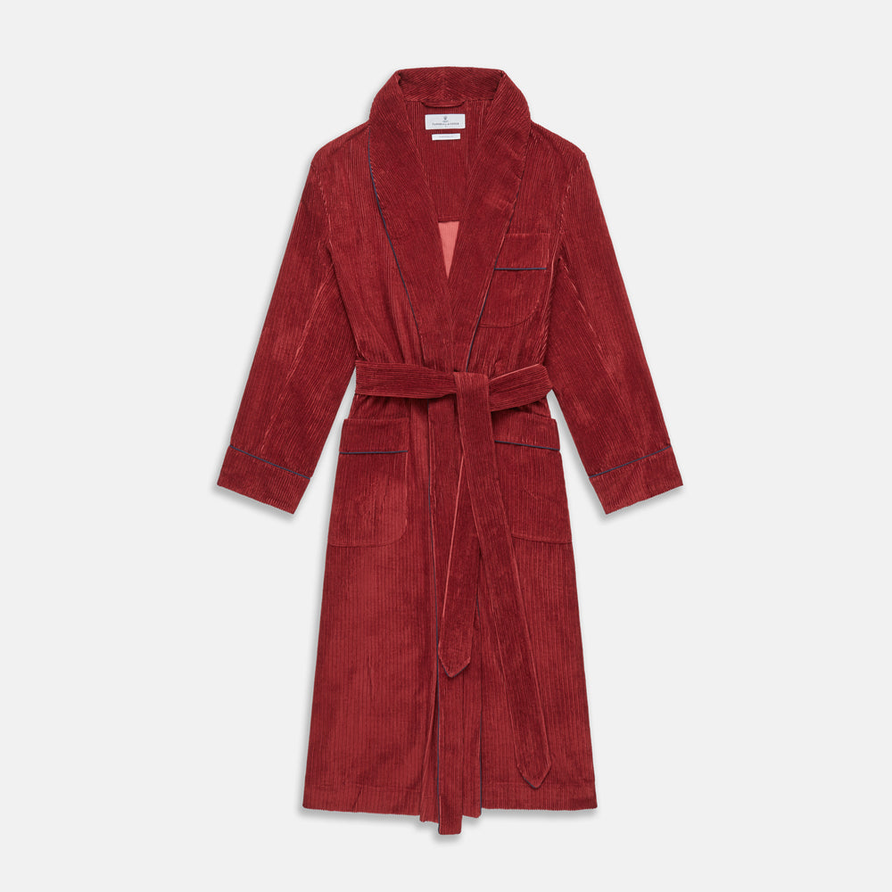 The Turnbull & Asser Burgundy Linen & Cotton Cord Gown, expertly made in England, features a shawl collar, patch pockets, and a matching fabric belt—shown here on a white background.