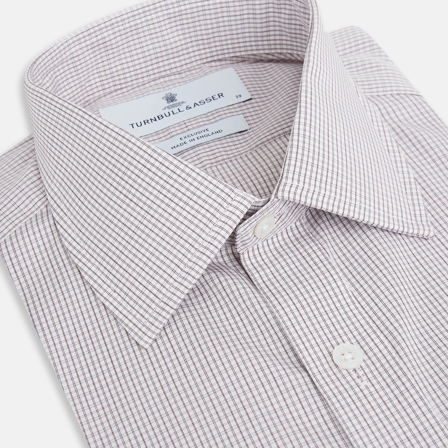 View 2 of product The Turnbull & Asser Burgundy Micro Tattersall Check Mayfair Shirt, crafted from Italian cotton with long sleeves, a button-down front, collar, and buttoned cuffs, is shown on a white background.