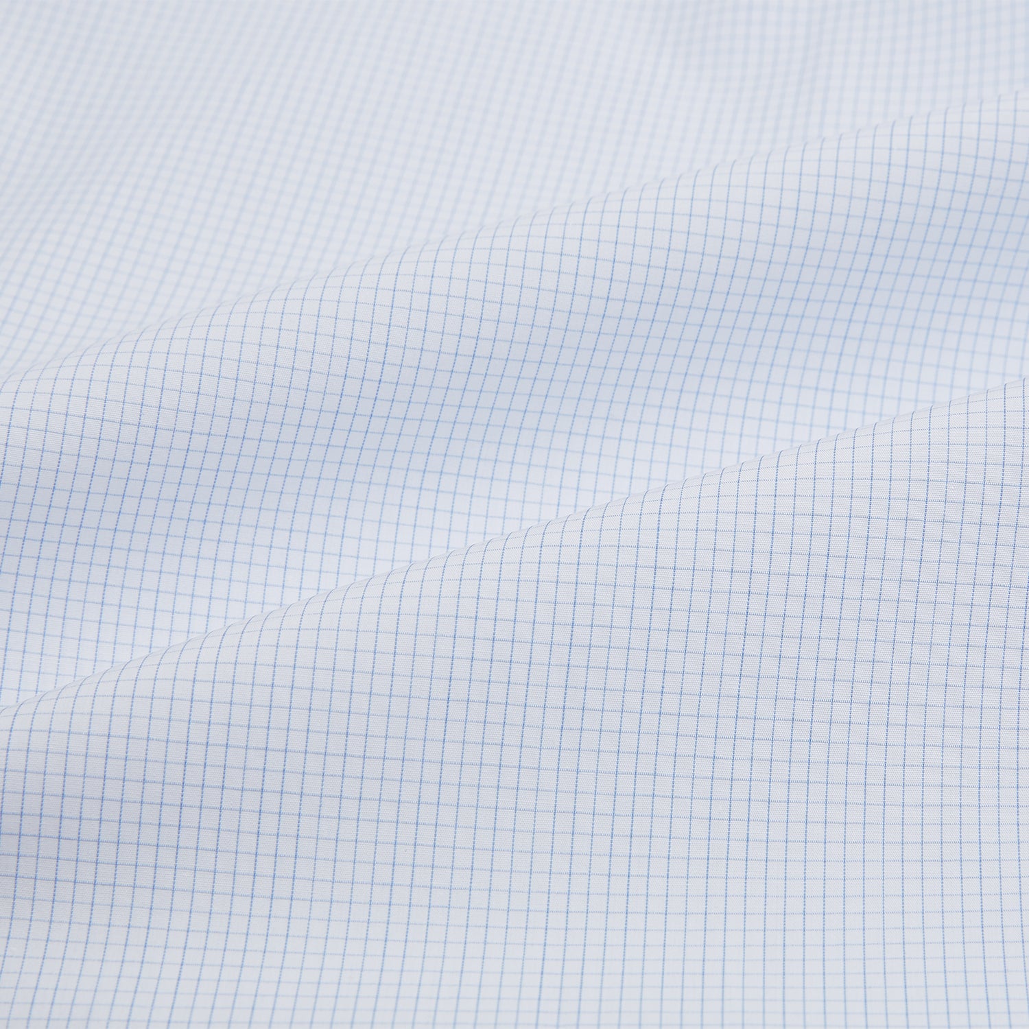 View 6 of product The Turnbull & Asser Blue and White Micro Check Mayfair Shirt features a pointed collar and white buttons, shown flat against a white background.