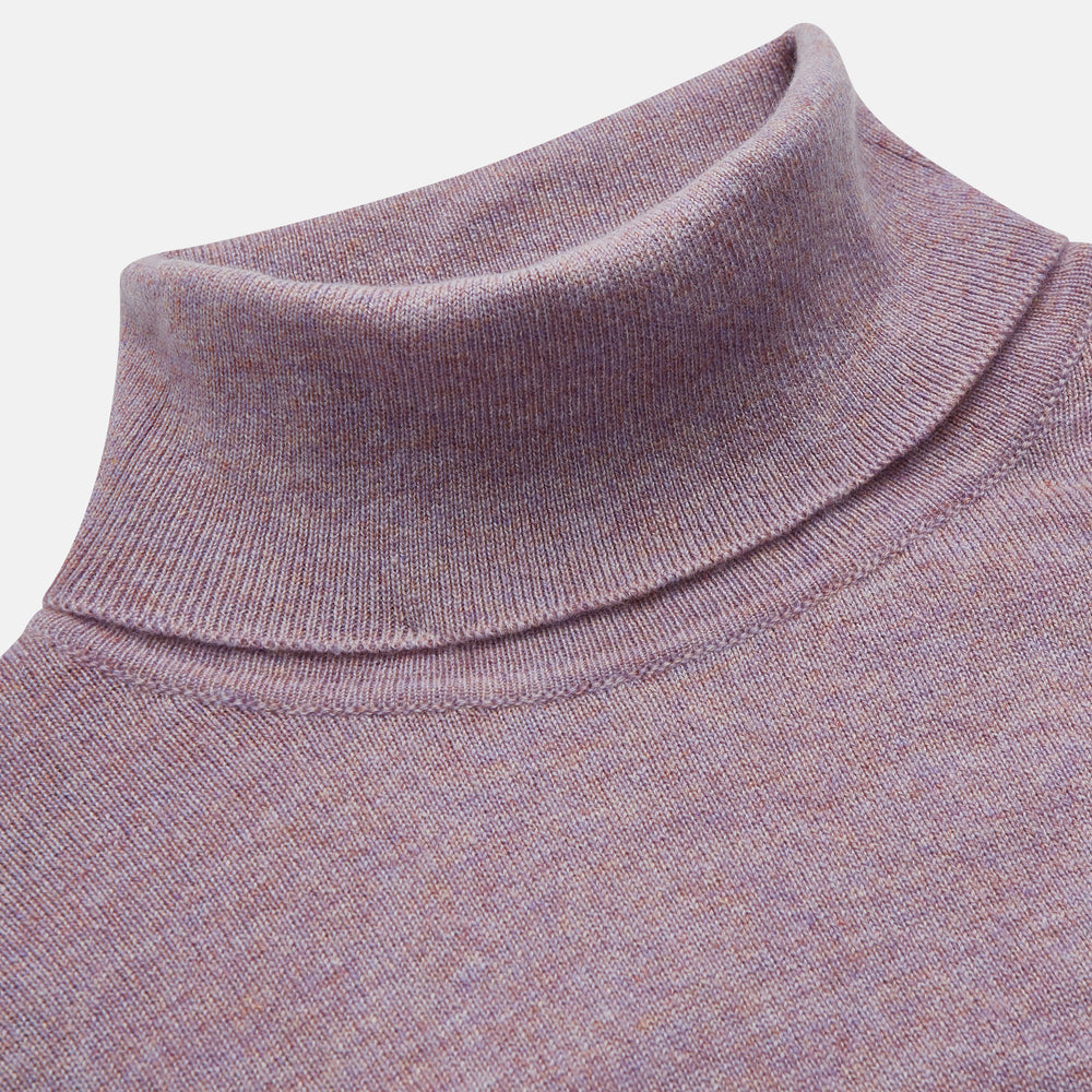 The Turnbull & Asser Lilac Heather Aubrey Cashmere Roll Neck Jumper features ribbed cuffs and hem—ideal for pairing with your favorite tailored trousers.