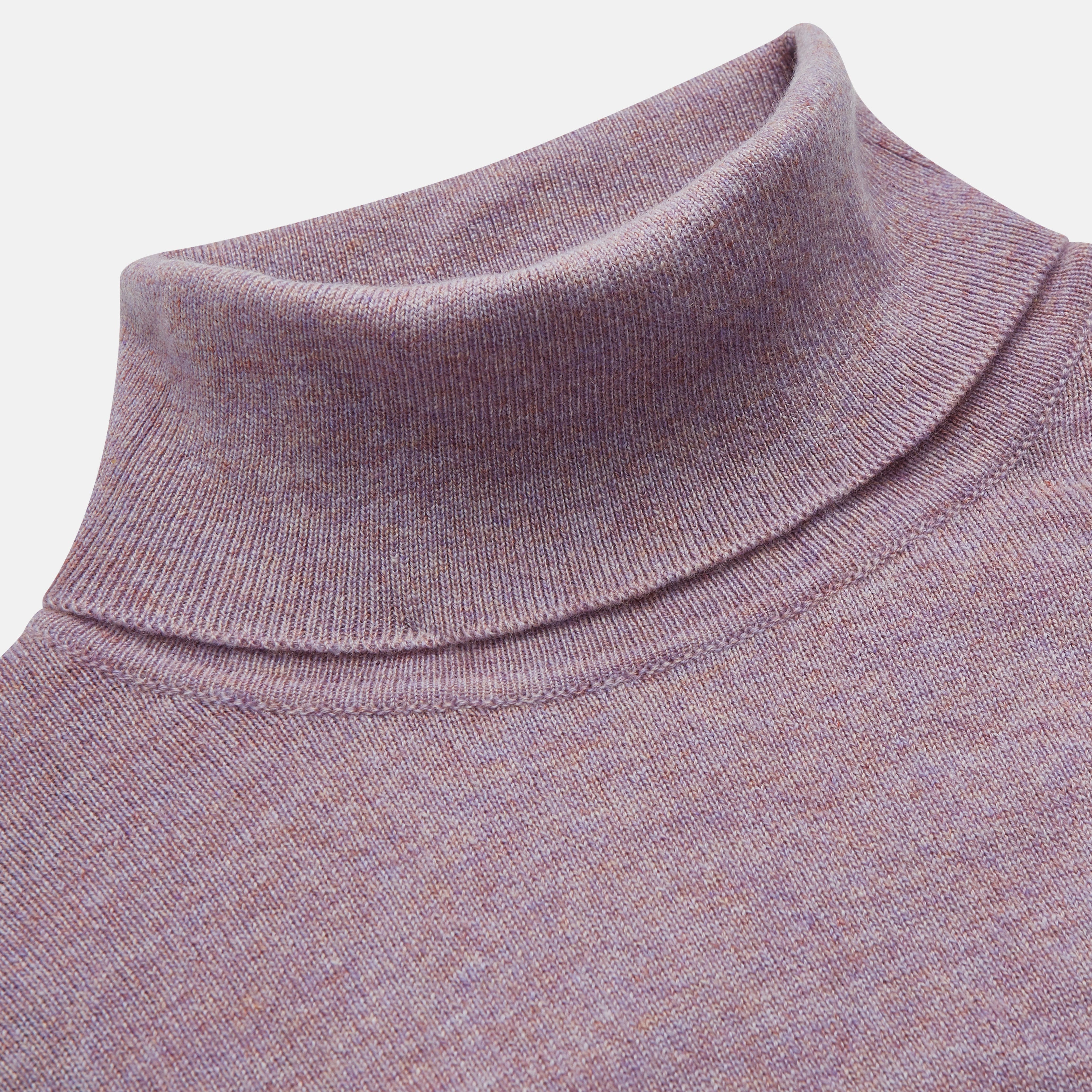 View 2 of product The Turnbull & Asser Lilac Heather Aubrey Cashmere Roll Neck Jumper features ribbed cuffs and hem—ideal for pairing with your favorite tailored trousers.