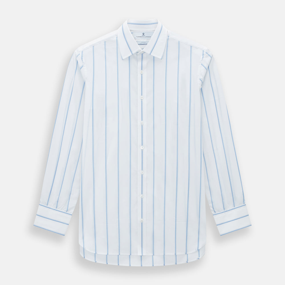 The Colony Blue Track Stripe Mayfair Shirt by Turnbull & Asser is a long-sleeve, button-up Italian cotton shirt with a white base and blue stripes, pointed collar, and buttoned cuffs, shown laid flat on a white background.