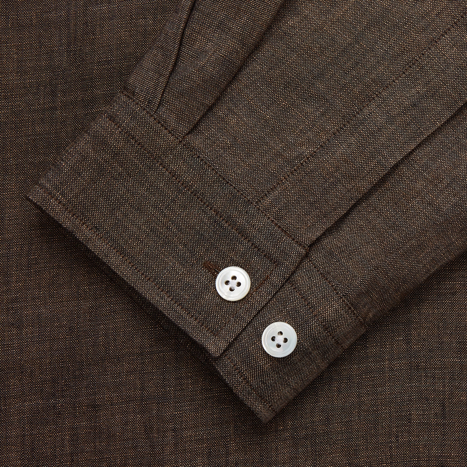 View 2 of product The Turnbull & Asser Chocolate Brown Linen Holiday Fit Fellows Shirt, featuring long sleeves, a classic collar, and white buttons, is displayed flat on a white background—ideal for effortless summer style.