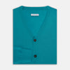 View 4 of product The Turnbull & Asser Turquoise Fine Merino V-Neck Cardigan features long sleeves, ribbed cuffs and hem, and black buttons, showcased against a plain white background.