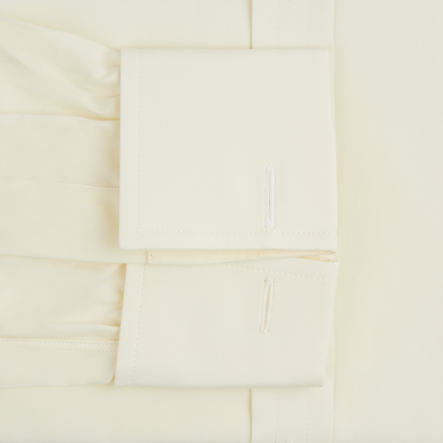 View 3 of product The Cream Cotton Shirt with T&A Collar and Double Cuffs by Turnbull & Asser is shown laid flat on a white background.