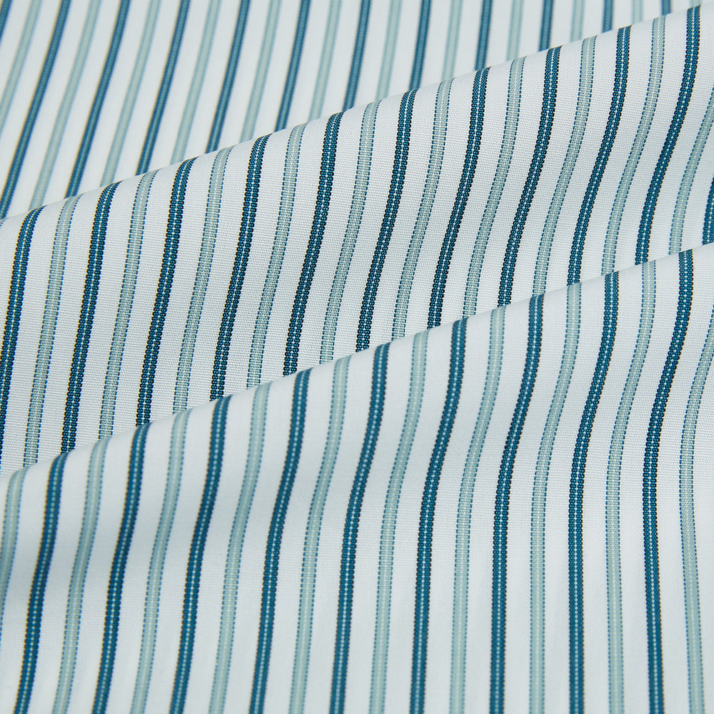 The GREEN DOUBLE STRIPE WESTMINSTER SHIRT by Turnbull & Asser features green and white vertical stripes, a pointed collar, buttoned cuffs, and a relaxed fit that highlights refined British craftsmanship.