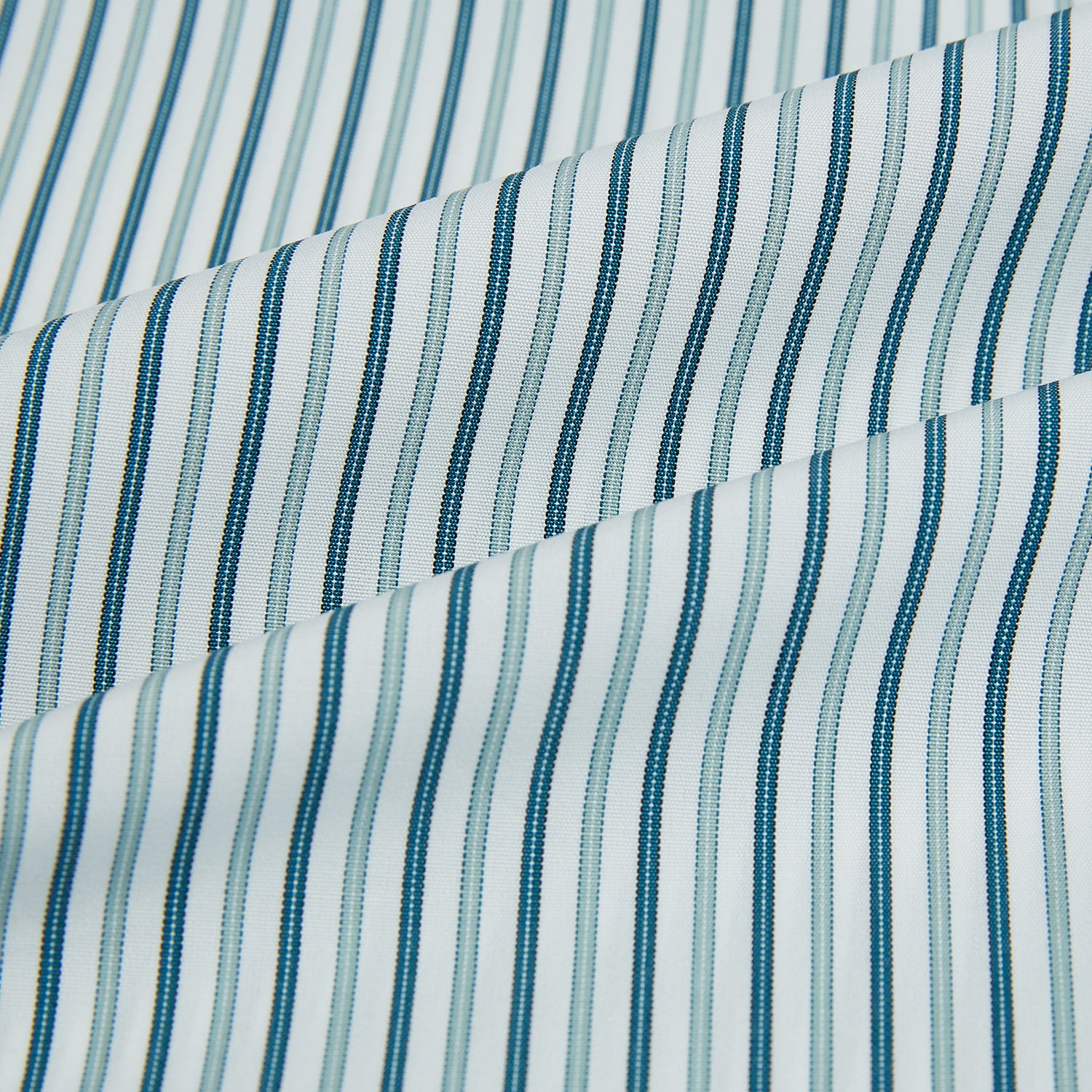 View 8 of product The GREEN DOUBLE STRIPE WESTMINSTER SHIRT by Turnbull & Asser features green and white vertical stripes, a pointed collar, buttoned cuffs, and a relaxed fit that highlights refined British craftsmanship.