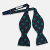 View 2 of product The Navy and Green Motif Silk Bow Tie by Turnbull & Asser features geometric floral patterns, ideal for formalwear, and is shown on a white background.