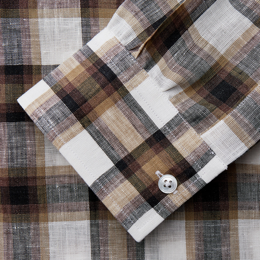 The Turnbull & Asser Brown Multi Check Linen Weekend Fit Hayne Shirt is a long-sleeve, button-up with a Dorset collar and buttoned cuffs, shown flat on a white background. It features a classic plaid pattern.