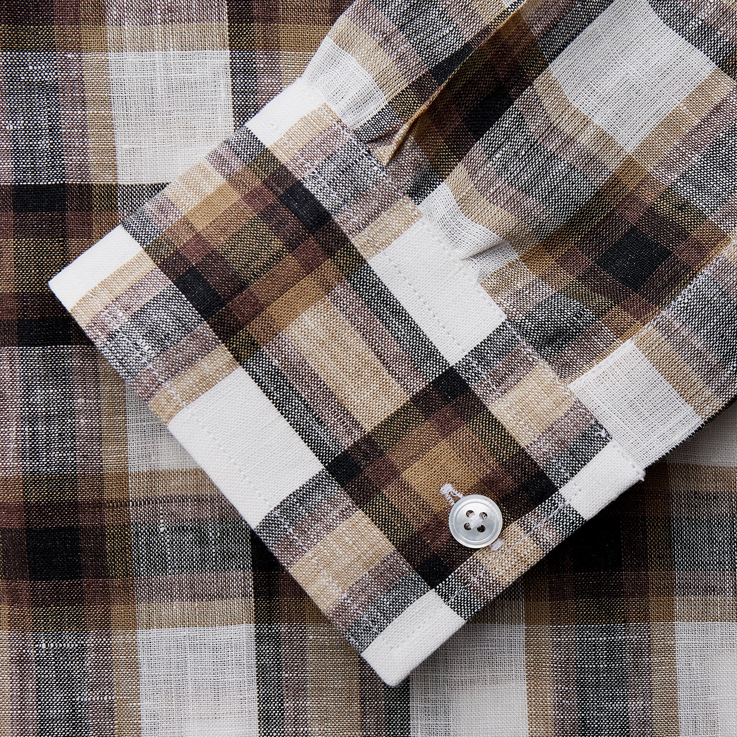 View 3 of product The Turnbull & Asser Brown Multi Check Linen Weekend Fit Hayne Shirt is a long-sleeve, button-up with a Dorset collar and buttoned cuffs, shown flat on a white background. It features a classic plaid pattern.