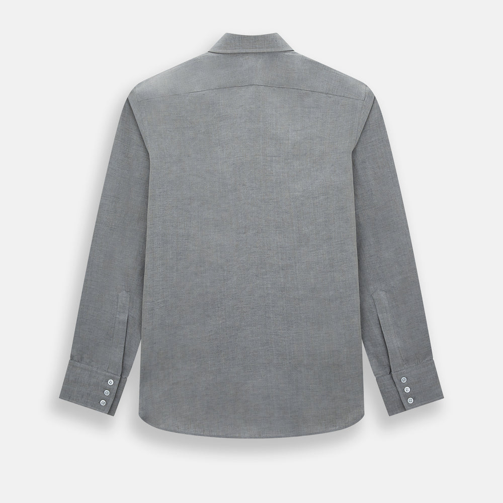 The Grey Linen Westminster Shirt by Turnbull & Asser is a long-sleeve, light gray button-up with a formal collar and white buttons, highlighting British craftsmanship and laid flat on a white background.