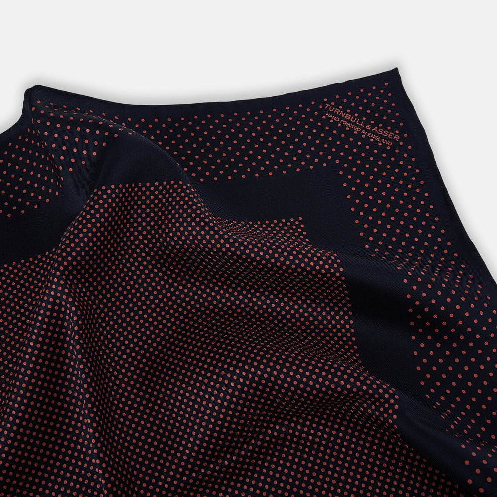 The Turnbull & Asser Navy and Orange Dot Silk Pocket Square features exquisite handmade craftsmanship.