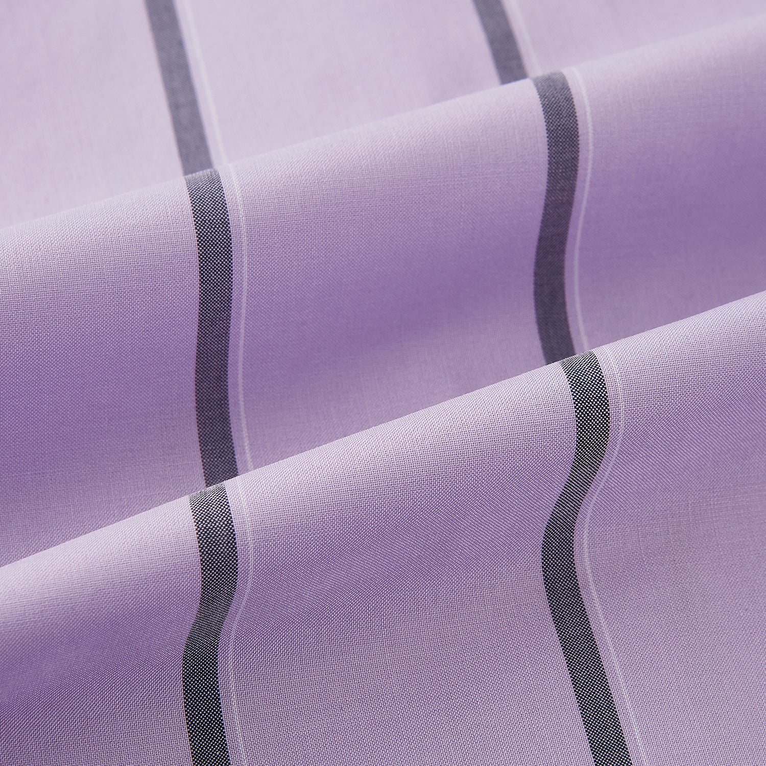 View 6 of product The Turnbull & Asser Lilac Track Stripe Mayfair Shirt is a long-sleeve Italian cotton shirt in light purple with dark lilac vertical stripes, shown laid flat on a white background.