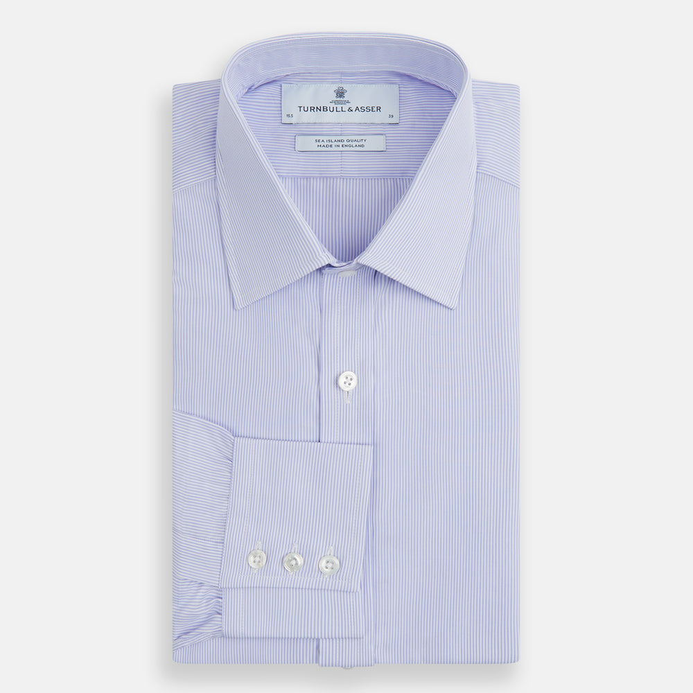 A Blue and White Fine Bengal Stripe Sea Island Quality Cotton Shirt by Turnbull & Asser, featuring a T&A collar and 3-button cuffs, is laid flat on a white background.