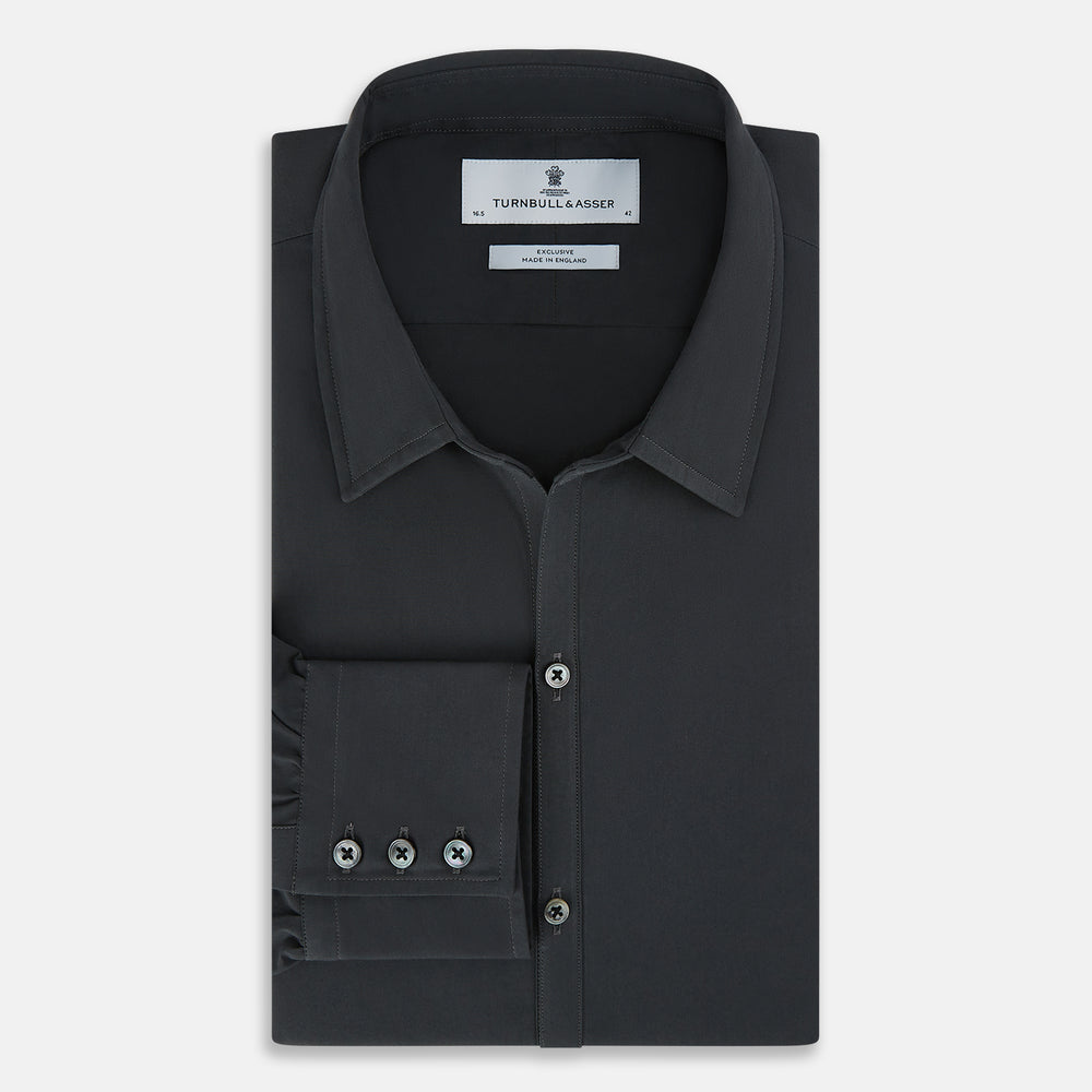 The Charcoal Windsor Shirt by Turnbull & Asser is a black, long-sleeve button-up with a pointed Windsor collar, buttoned cuffs, and a straight hem, shown flat on a white background.