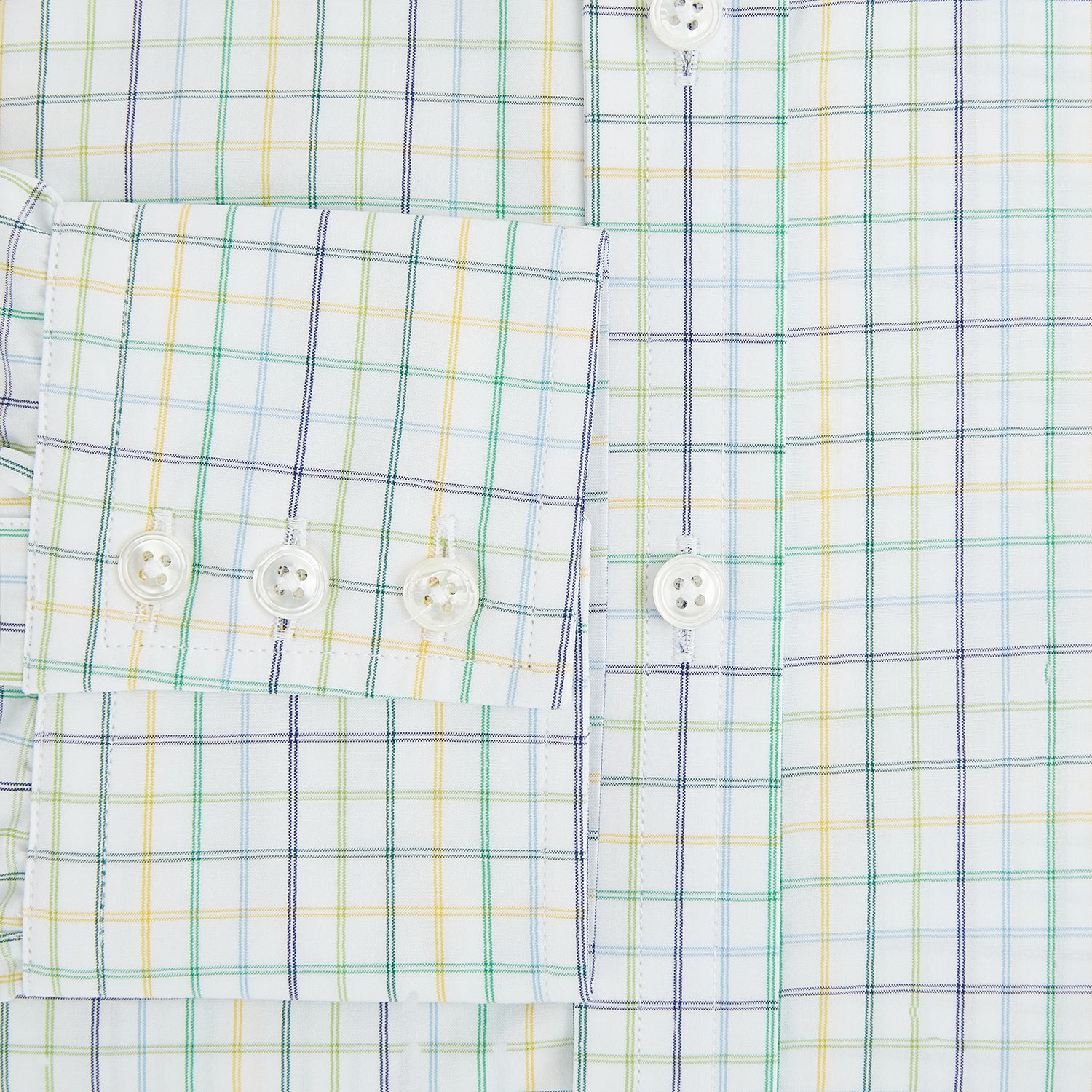 View 4 of product The Turnbull & Asser Multi Tone Double Grid Check Mayfair Shirt is a long-sleeve, button-up with a classic collar, showcasing pure cotton light blue, green, and yellow grid checks on white, neatly displayed flat against a white surface.