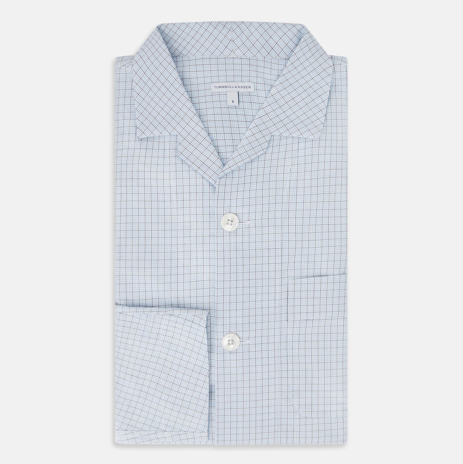 View 5 of product The Turnbull & Asser Blue Graph Check Pyjama Shirt features long sleeves, a collar, and a small check pattern in light blue—ideal as elegant loungewear.