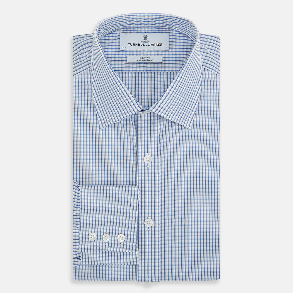 The Sky Blue Micro Shadow Check Mayfair Shirt by Turnbull & Asser features long sleeves, a classic collar, buttoned cuffs, and a light blue and white micro check pattern—showcasing refined British craftsmanship.