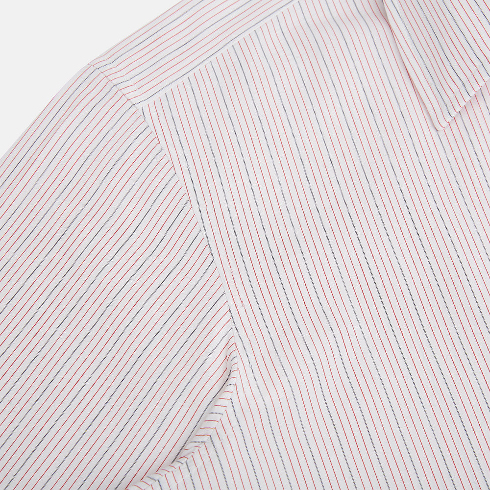 The Red Hairline Stripe Westminster Shirt by Turnbull & Asser features a pointed collar and thin vertical stripes in a light hue, displayed flat against a white background—a fine example of British craftsmanship.