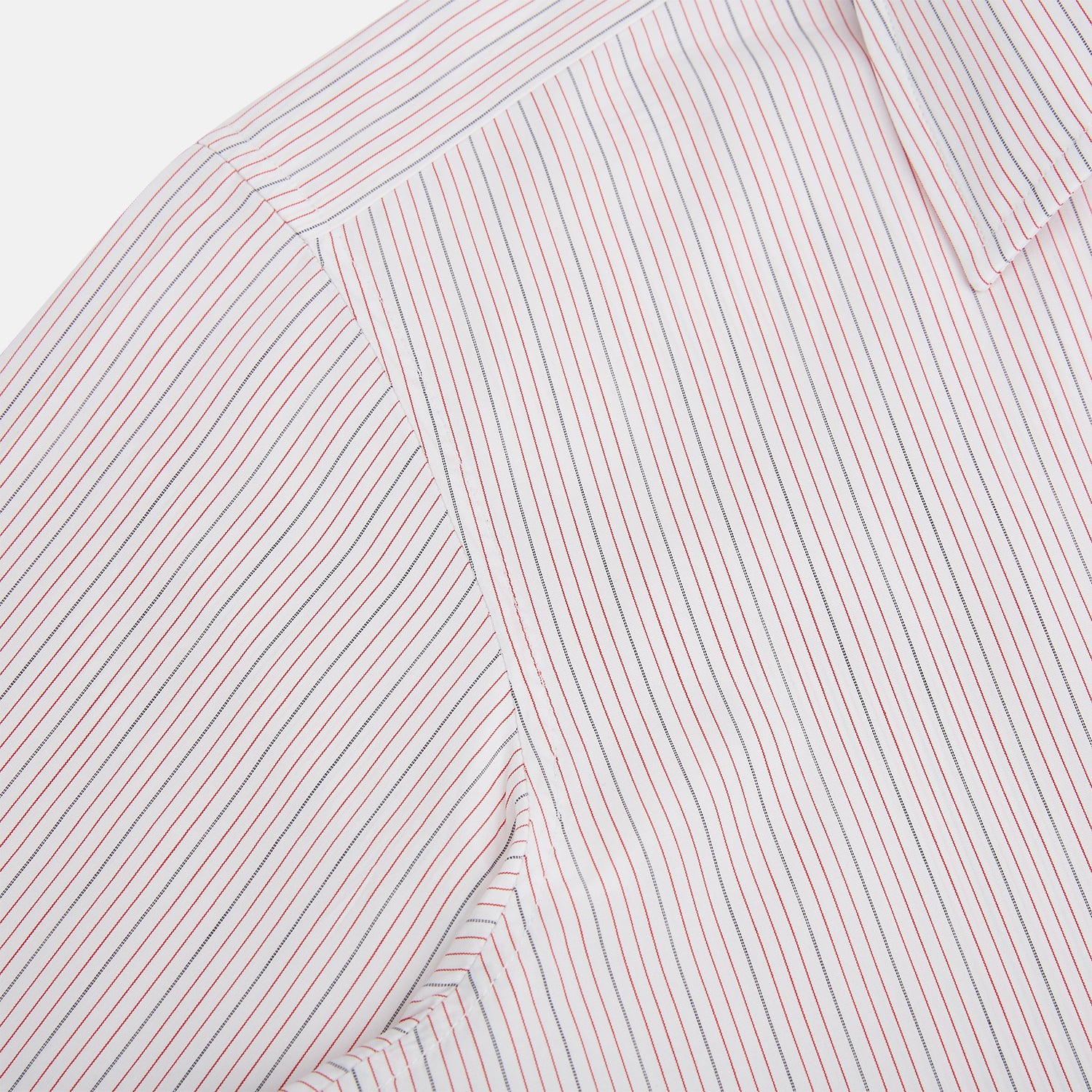 View 6 of product The Red Hairline Stripe Westminster Shirt by Turnbull & Asser features a pointed collar and thin vertical stripes in a light hue, displayed flat against a white background—a fine example of British craftsmanship.