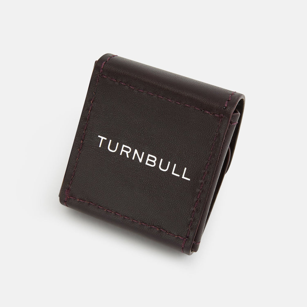 The Burgundy Leather Cufflinks by Turnbull & Asser feature square Italian leather with visible edge stitching and braided loops, presented on a white background—an elegant addition to men's accessories.